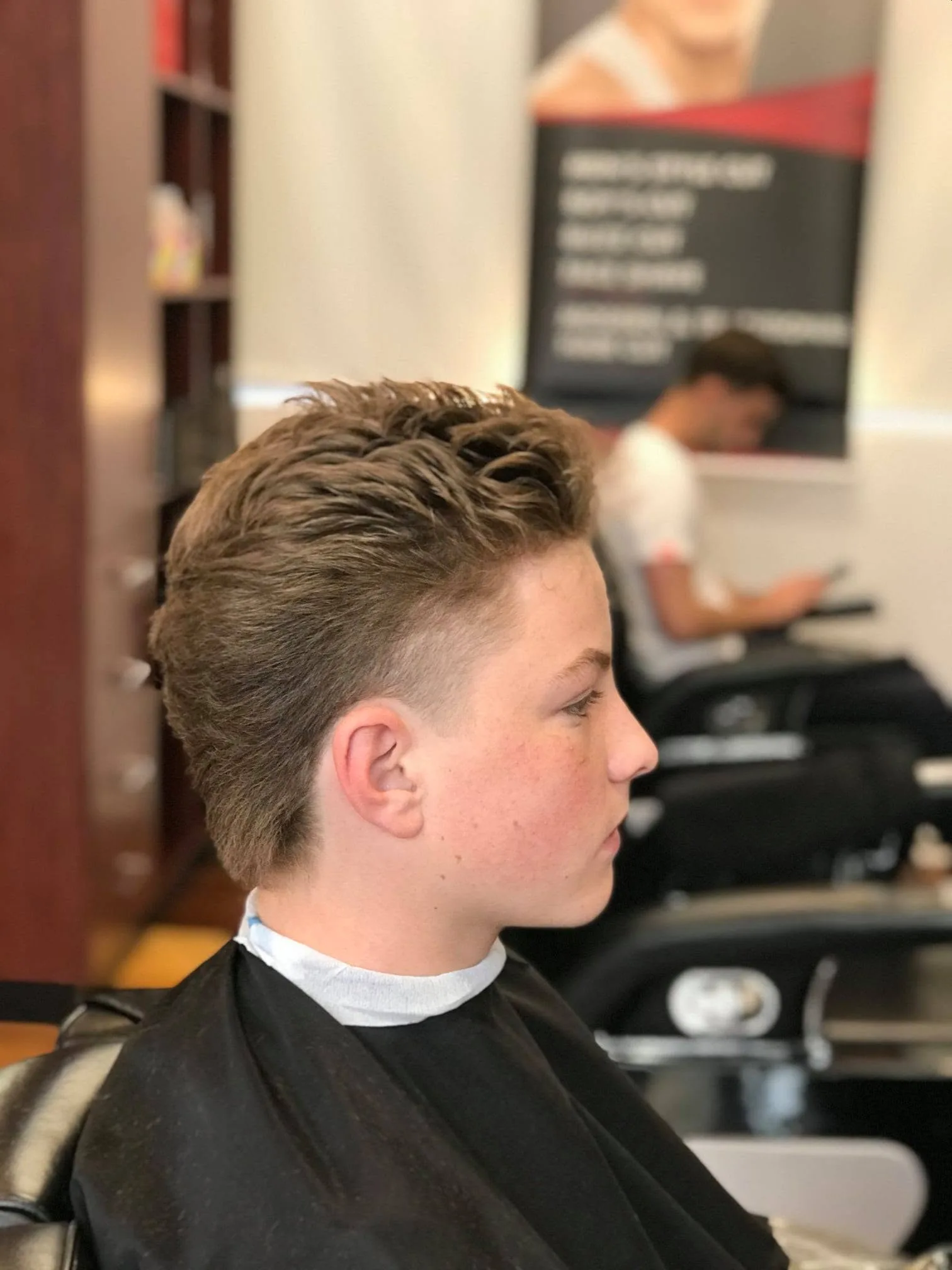 Boy's finished textured quiff and fade