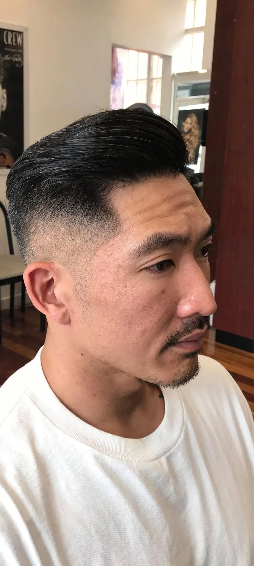 Finished slicked-back pompadour with skin fade