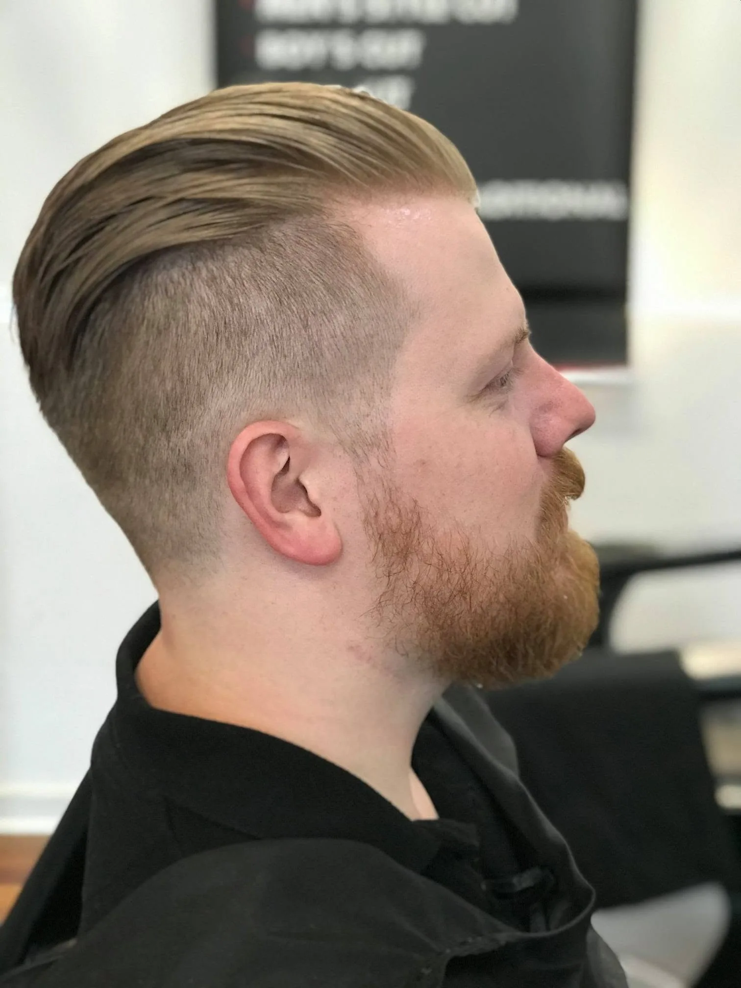 Profile — slicked-back top with faded sides